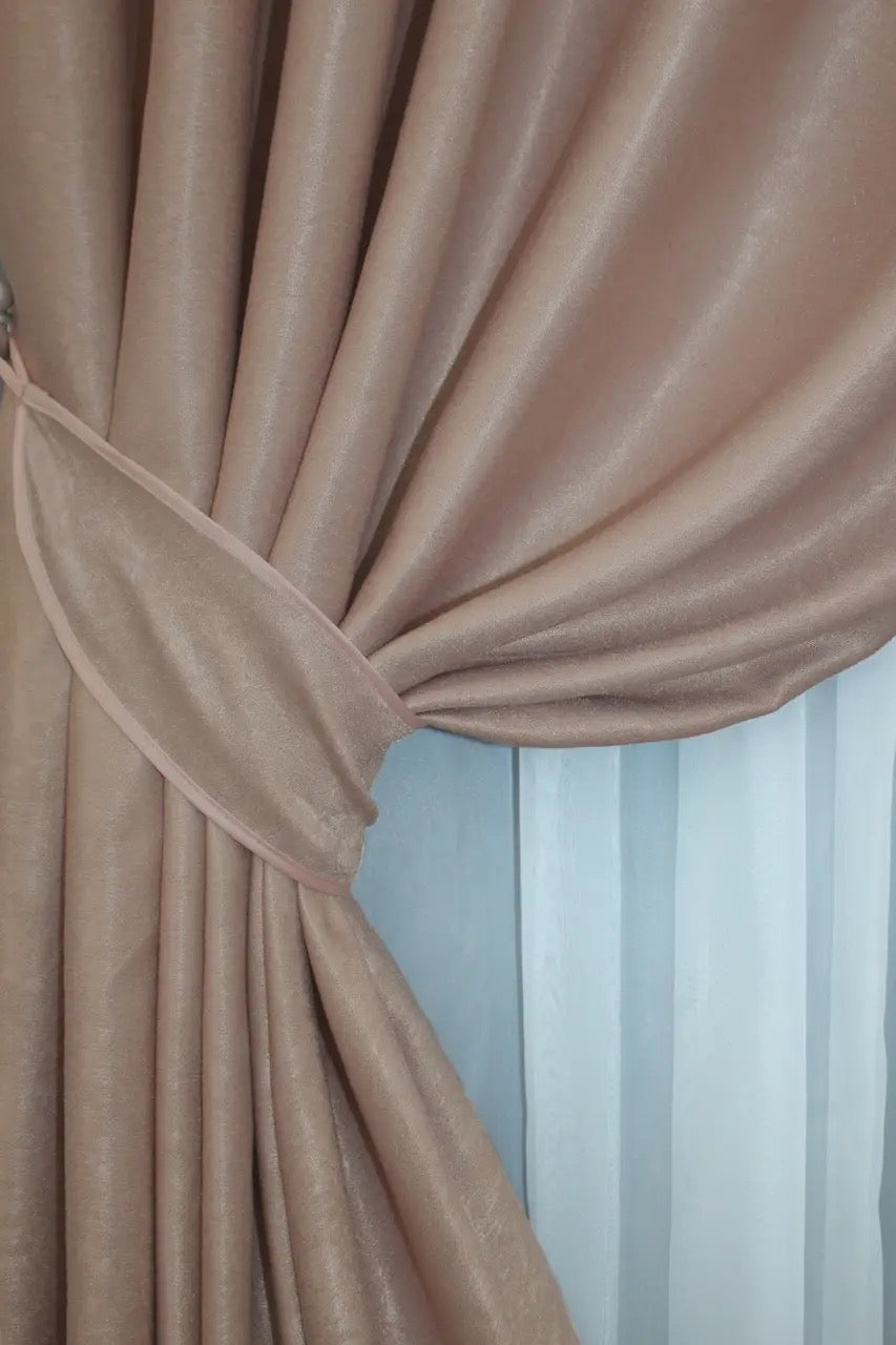 Almond beige velvet curtains with a rich and smooth texture, ideal for elegant window treatments in living rooms and bedrooms.