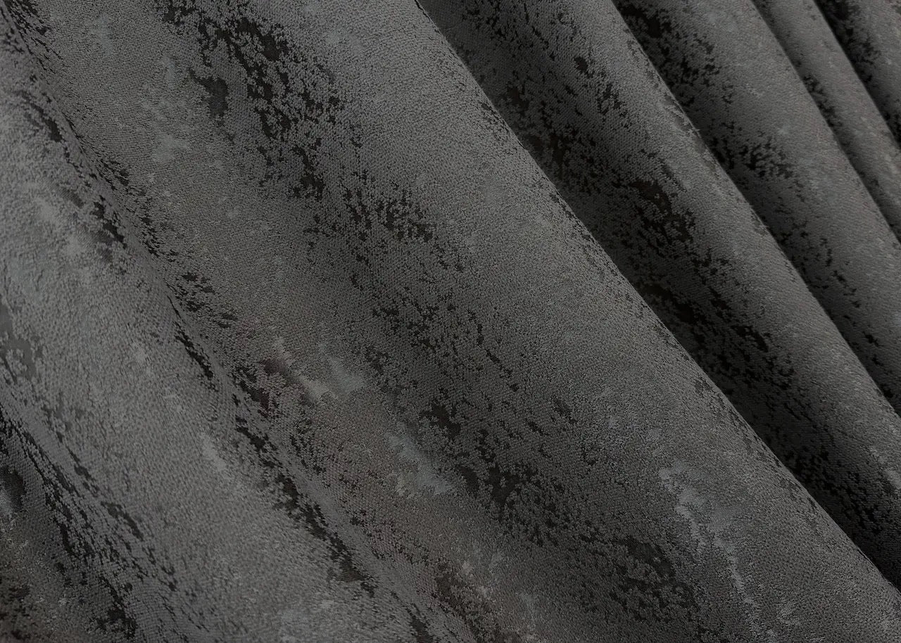 Versatile brown linen drapes providing privacy while allowing soft, natural light to filter through.