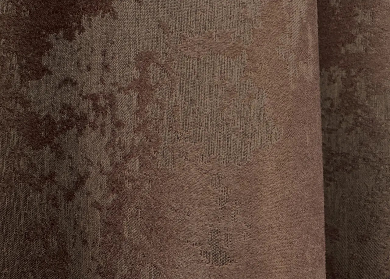 Elegant brown curtains styled in a bedroom setting, creating a cozy and sophisticated ambiance.