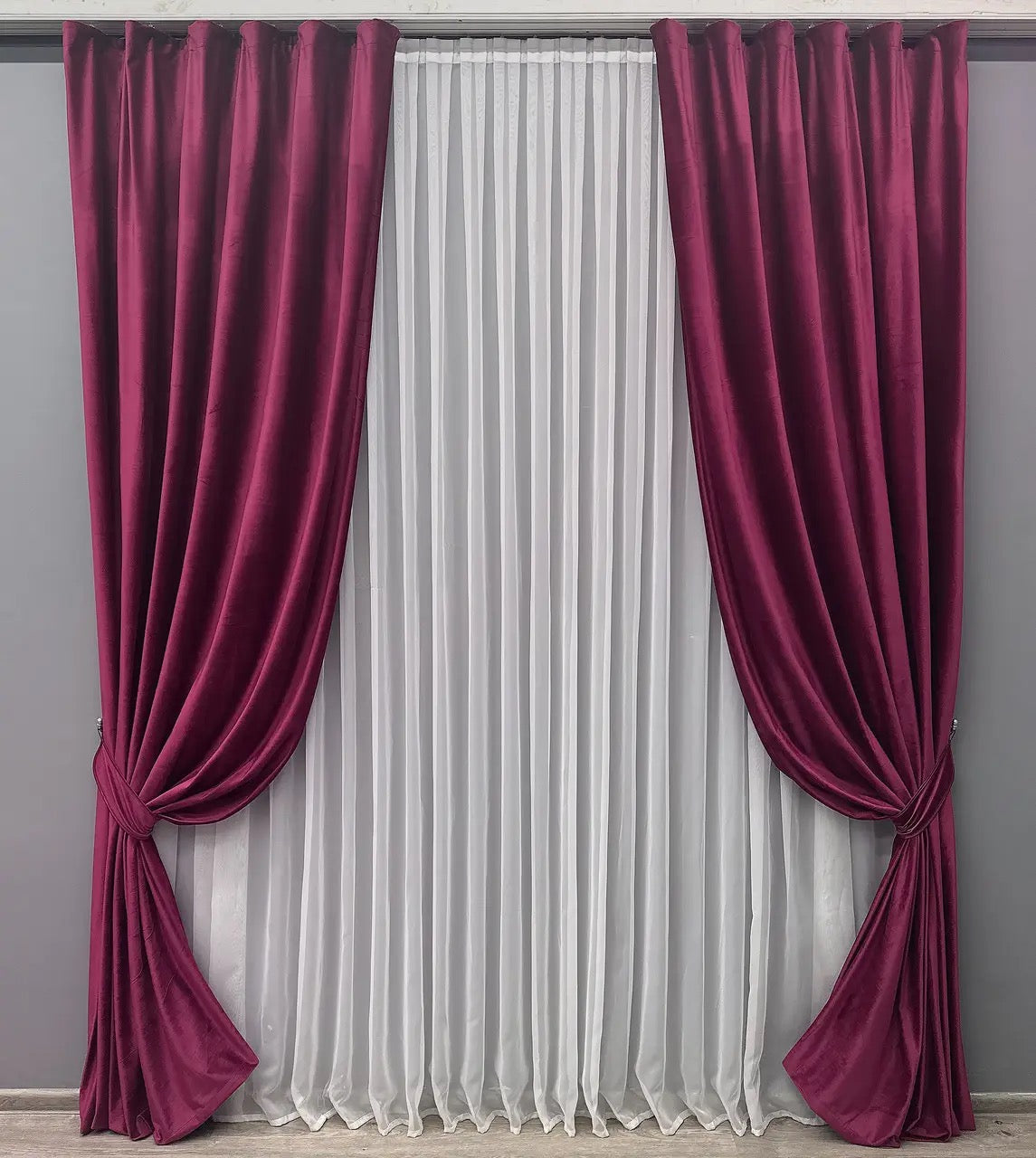 Burgundy velvet blackout curtains, adding a touch of elegance and style to any living space.