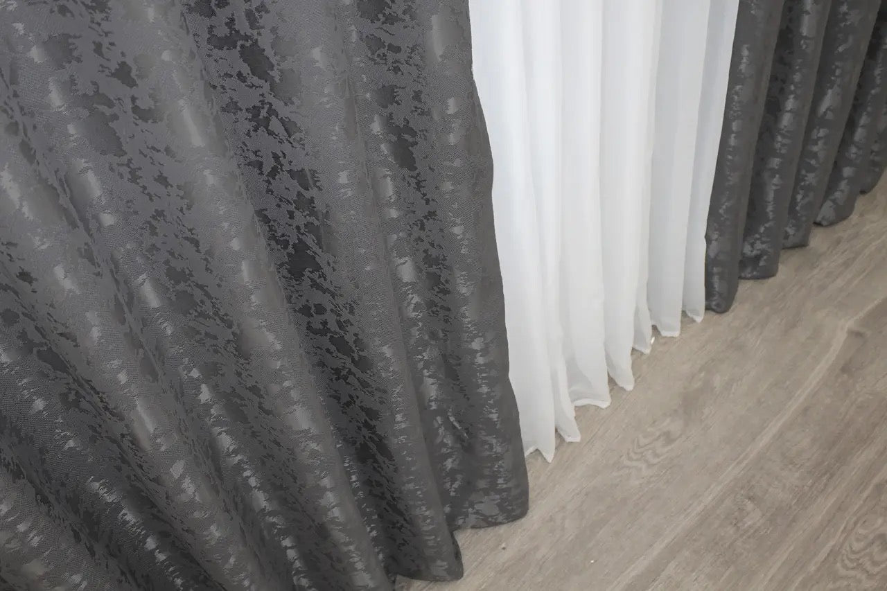 Ultra-soft grey linen curtains with a delicate marble effect, complementing cool-toned and neutral decor.