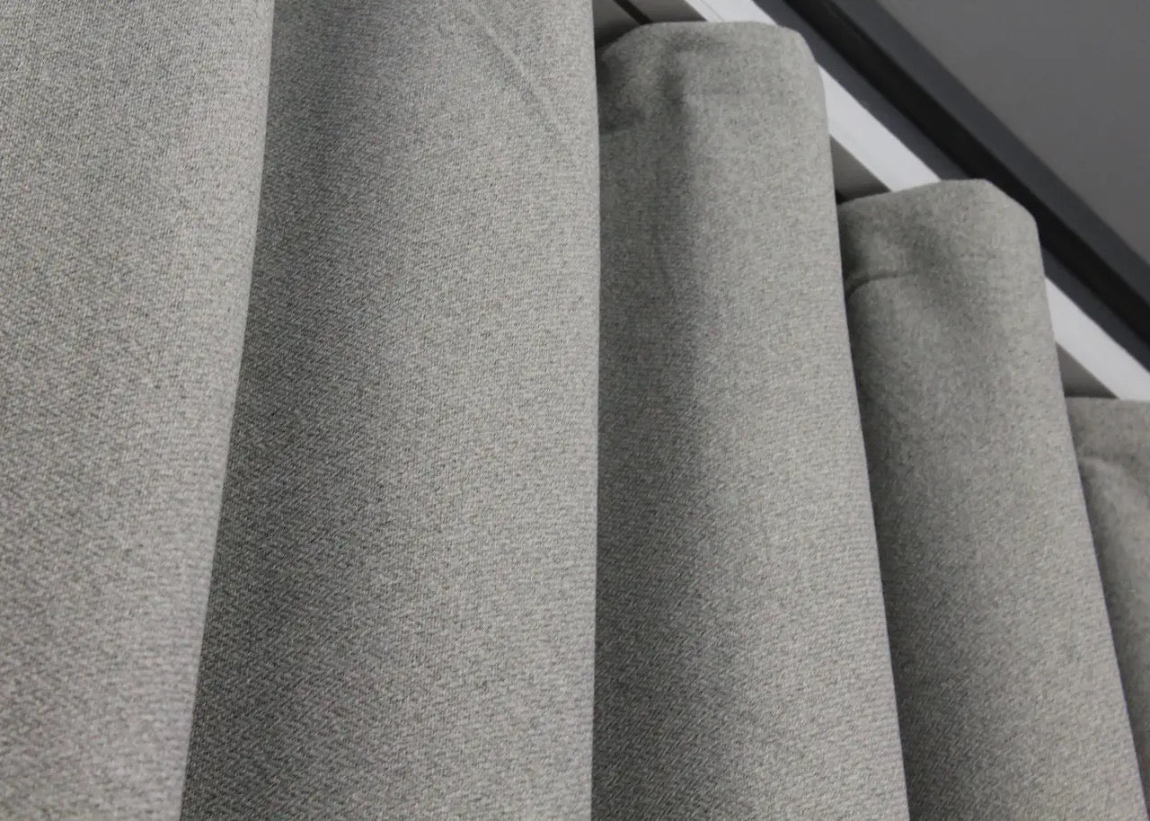 Thermal-insulated light grey linen blackout curtains, perfect for energy efficiency and a serene home environment.