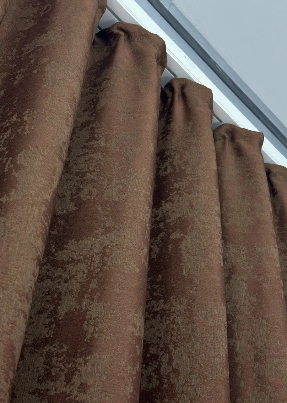 Classic-style brown jacquard curtains with matching tie-backs, perfect for refined window décor.