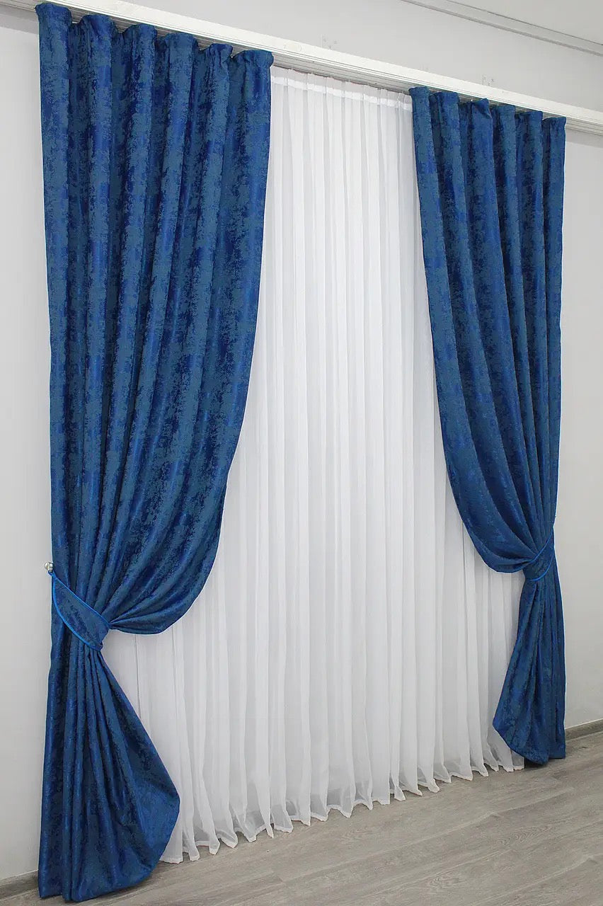 Stylish Ocean Blue jacquard curtains designed with 70% light-blocking fabric for privacy while allowing soft natural light.