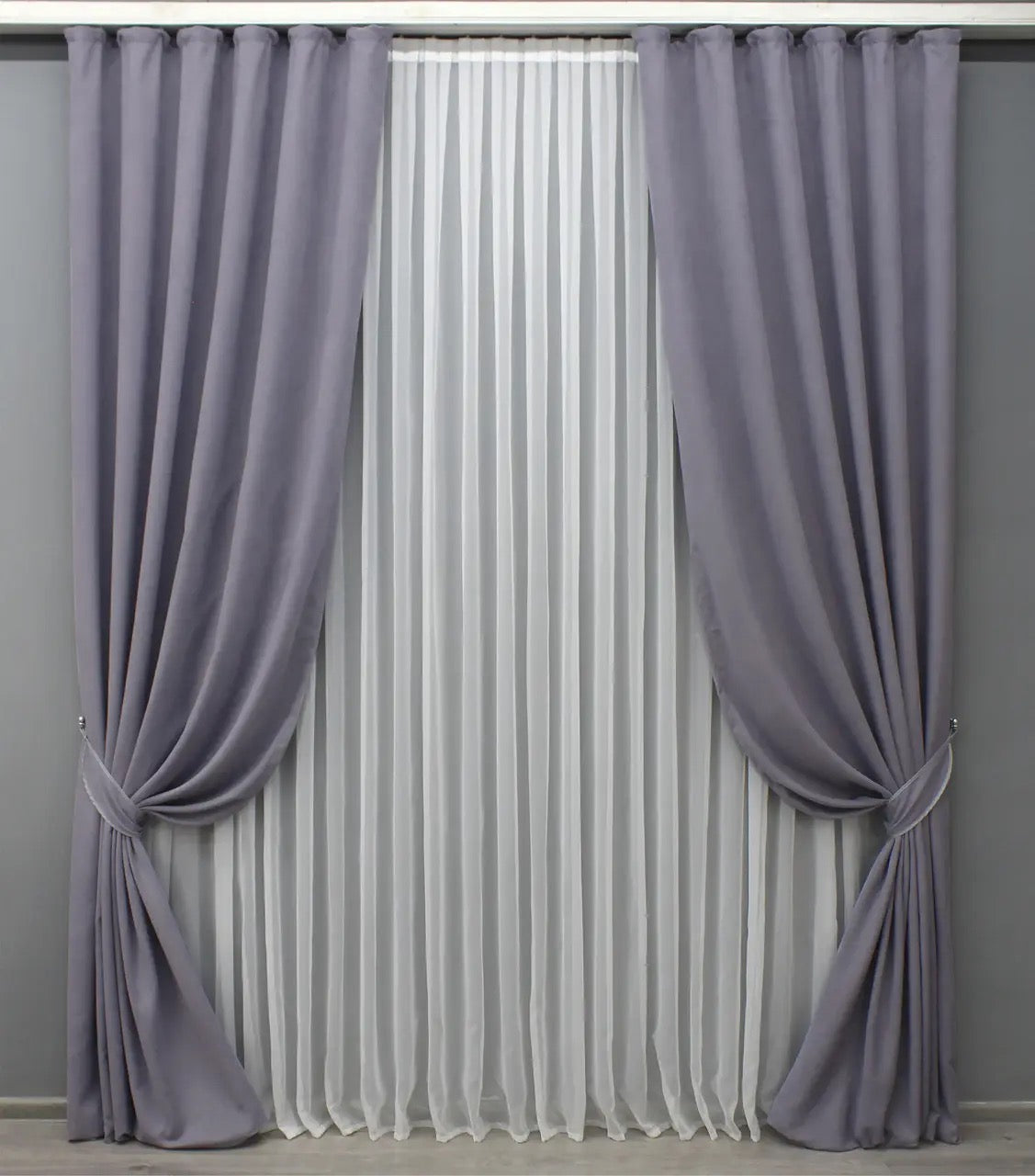 Luxury muted purple-gray velvet curtains with a smooth texture, ideal for stylish bedrooms and living rooms.