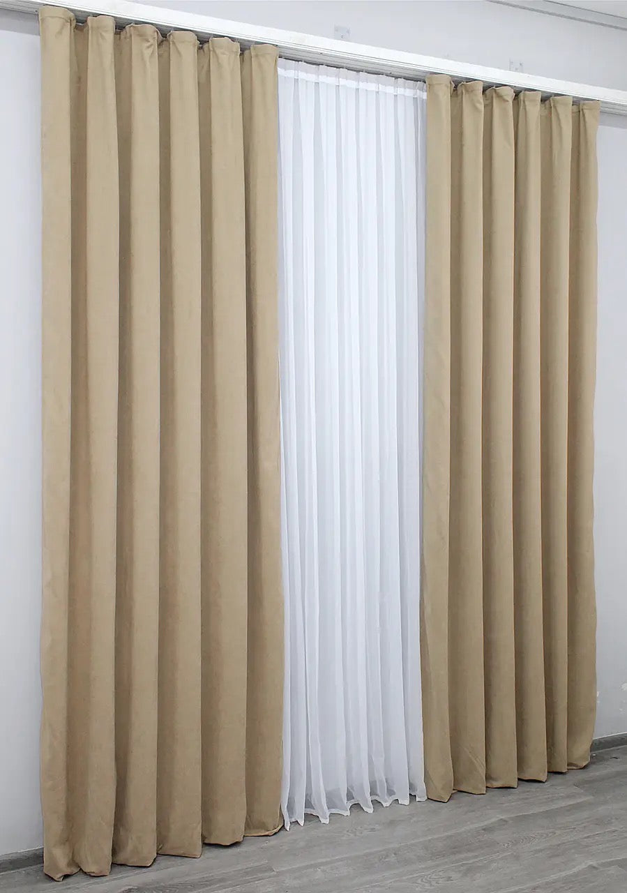 Velvety soft beige curtains with a smooth drape, enhancing both modern and classic interiors.
