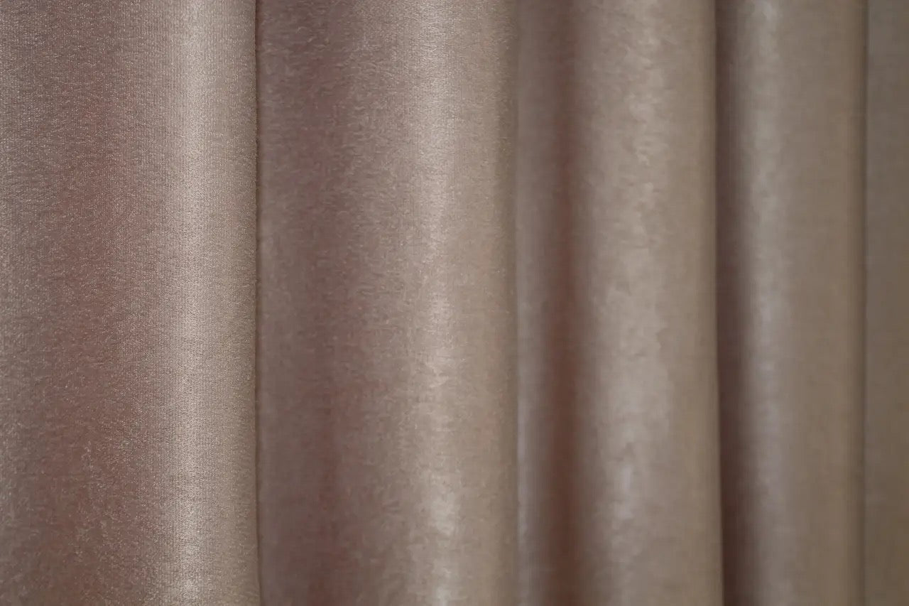 Latte velvet room-darkening curtains, crafted for high-end interior design and improved privacy.