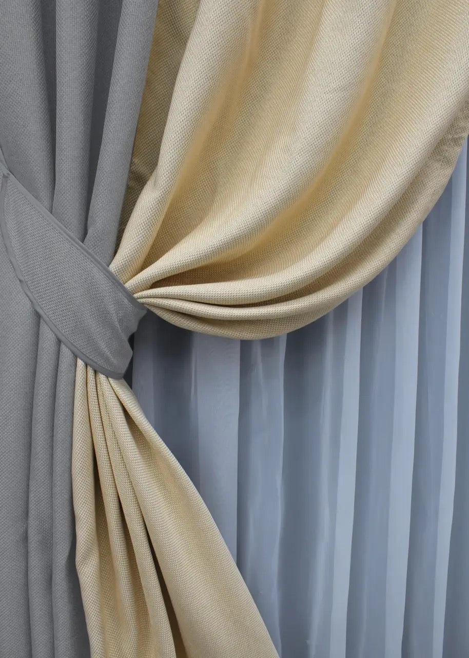Two-tone light grey and beige linen blackout curtains seamlessly stitched together for a polished and harmonious contrast in any space.