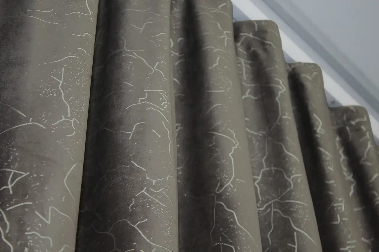 Soft, luxurious dark brown velvet curtains with light-blocking capabilities, ideal for enhancing privacy in bedrooms and living rooms.