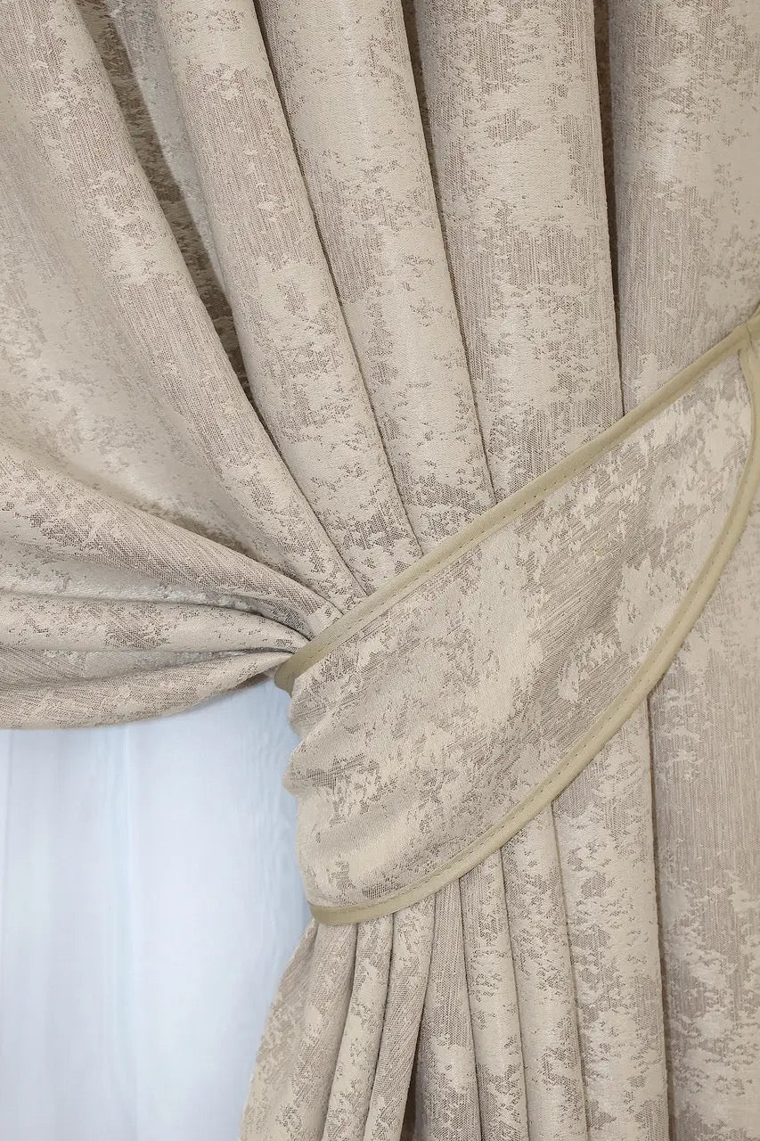Non-blackout grey-beige jacquard curtains that provide privacy while letting soft natural light filter through.