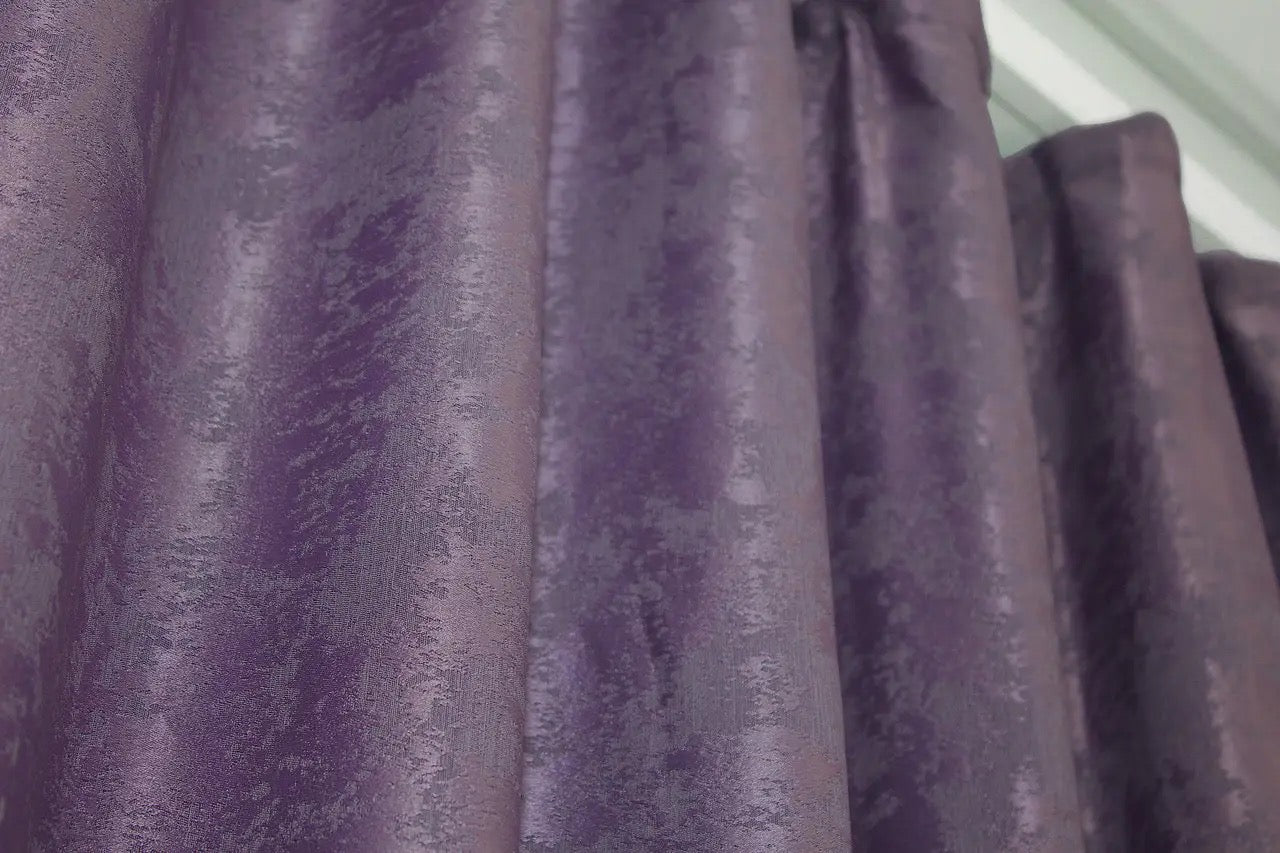 Semi-blackout purple jacquard curtains that filter natural light while enhancing the aesthetics of any room.