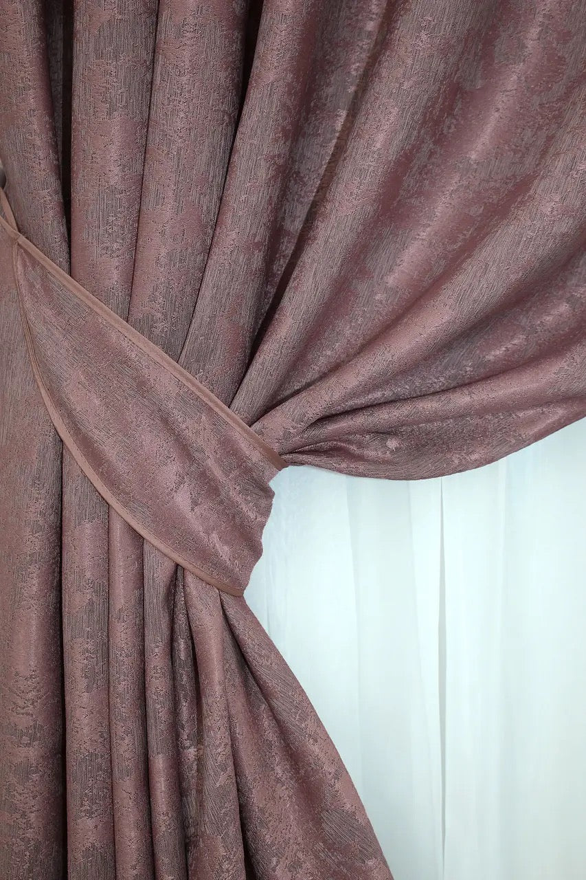 Non-blackout raspberry grey jacquard curtains that provide privacy while letting soft natural light filter through.
