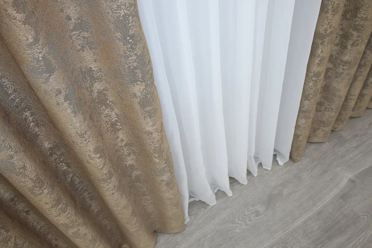 Luxurious soft cappuccino curtains with an intricate jacquard weave, adding depth, elegance, and warmth to any home.