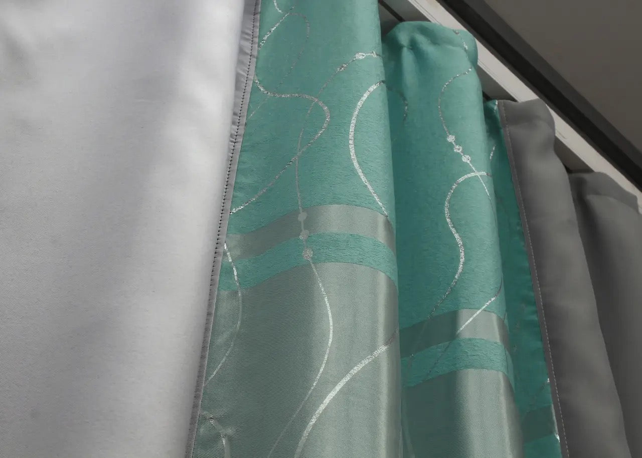 Luxurious graphite & turquoise-grey blackout curtains that add a modern, stylish flair to your home’s decor.