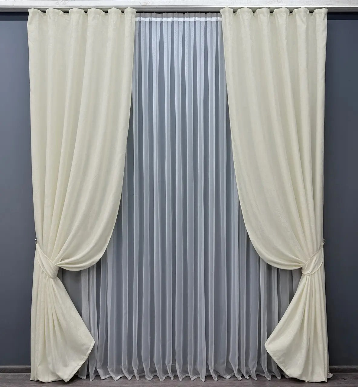Luxury cream jacquard curtains with intricate woven patterns, adding warmth and refinement to any modern or classic interior.