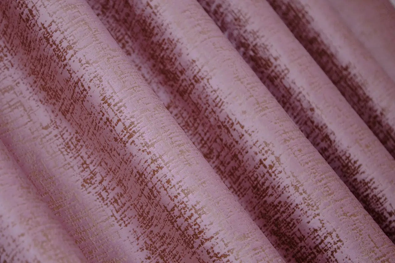 Timeless pink and gold velvet drapes with 90% light-blocking capability, creating a serene and luxurious environment.