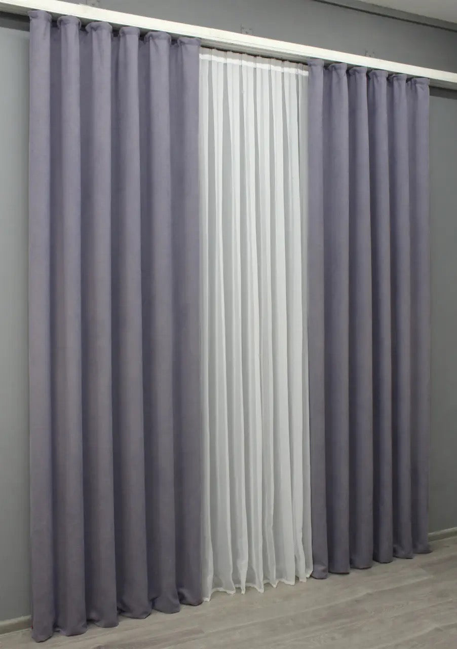 Soft-touch dusty lavender curtains with an elegant sheen, designed for a cosy and inviting atmosphere.