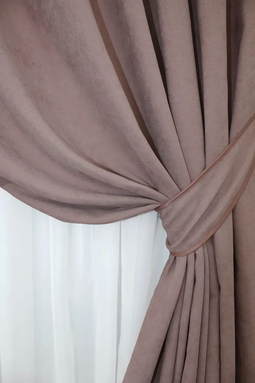 Soft-touch dusty pink curtains with an elegant sheen, designed for a cosy and inviting atmosphere.