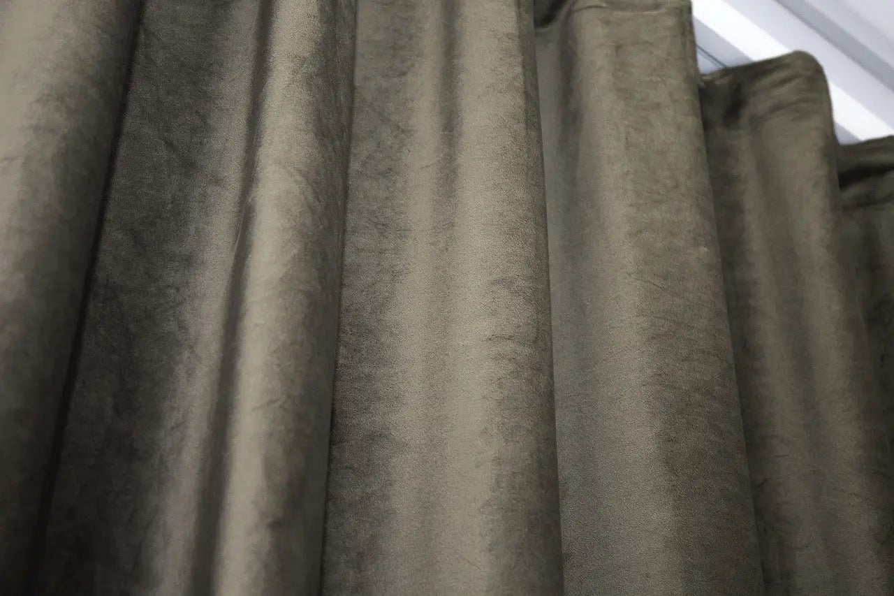 Stylish moss velvet curtains for modern interiors, perfect for creating a luxurious feel in bedrooms and living rooms.