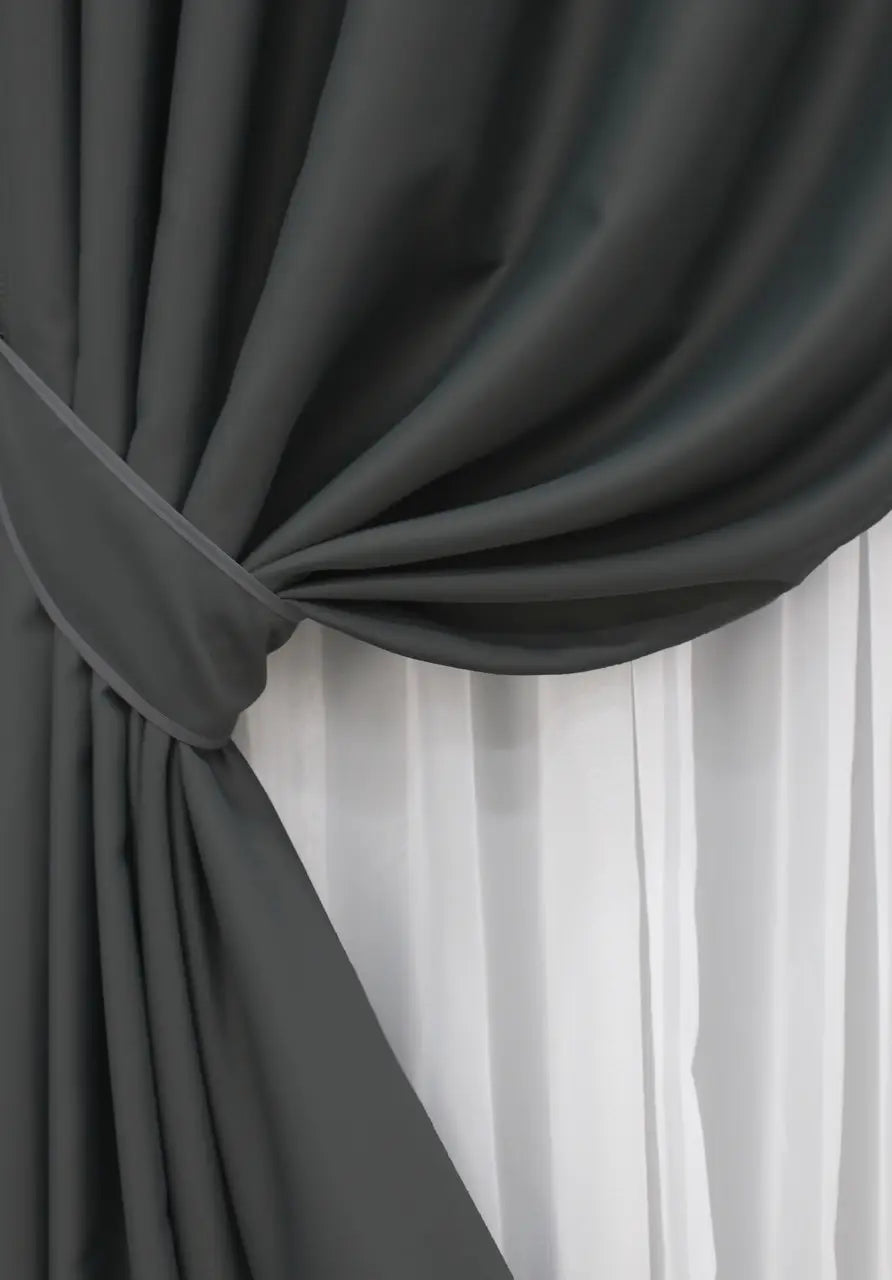 Matte graphite blackout curtains providing a sophisticated and refined finish.