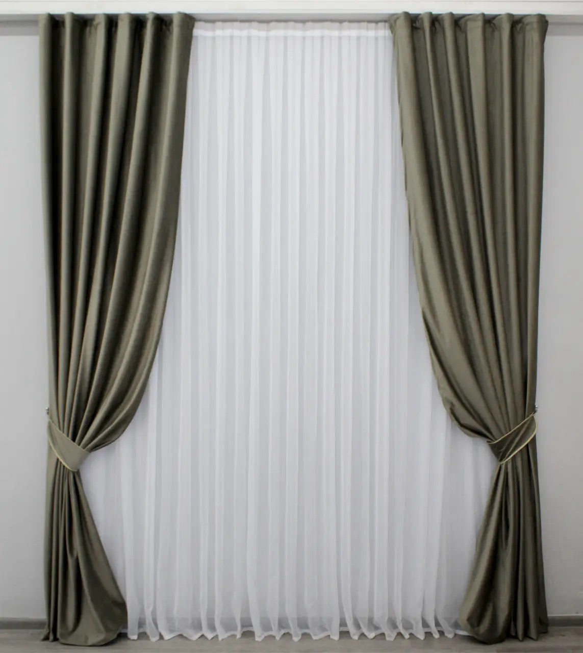 Premium moss velvet blackout curtains in soft green, perfect for modern living rooms and bedrooms, offering elegance and privacy.