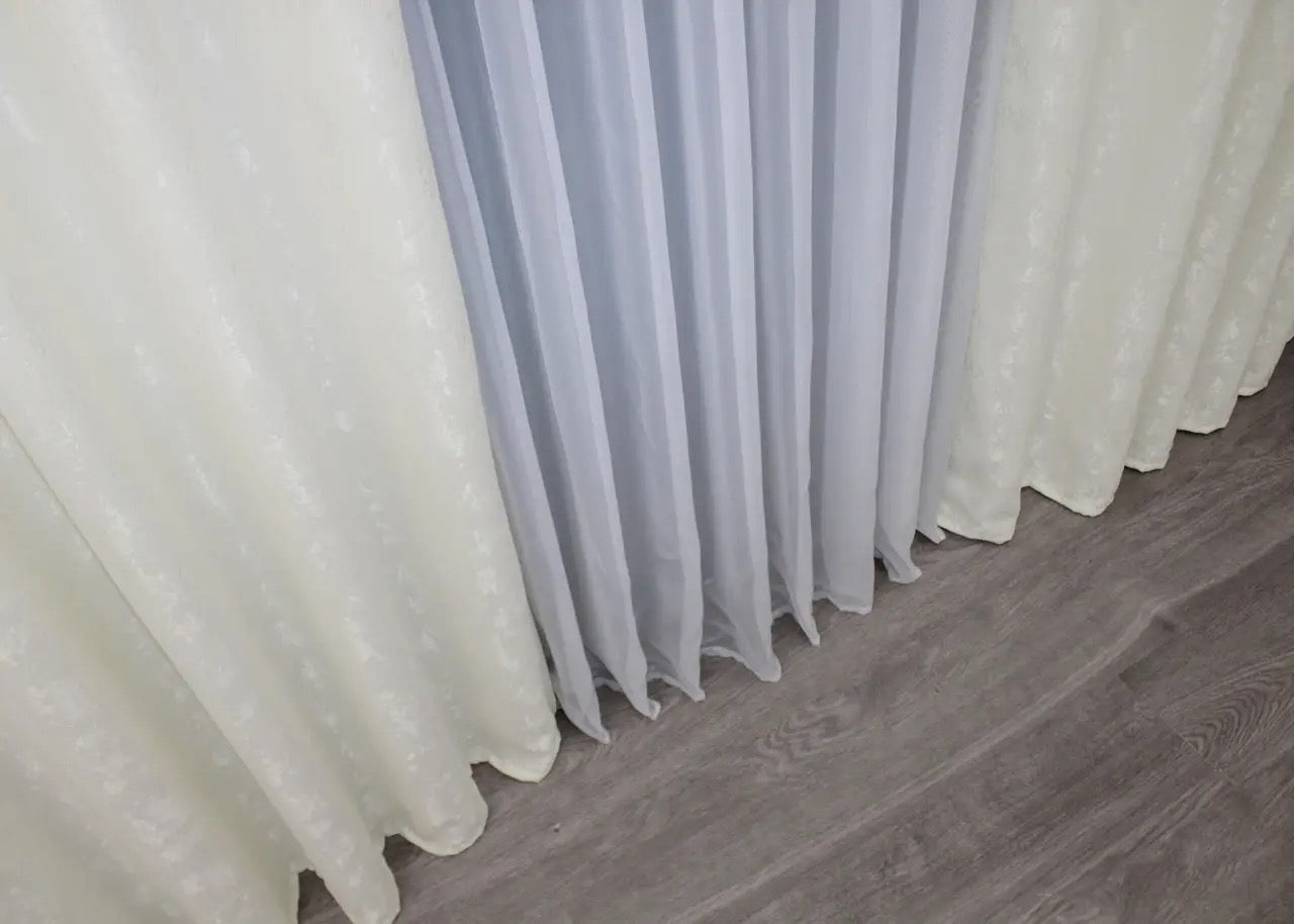 Classic cream linen curtains with a refined texture, creating a serene and sophisticated interior.