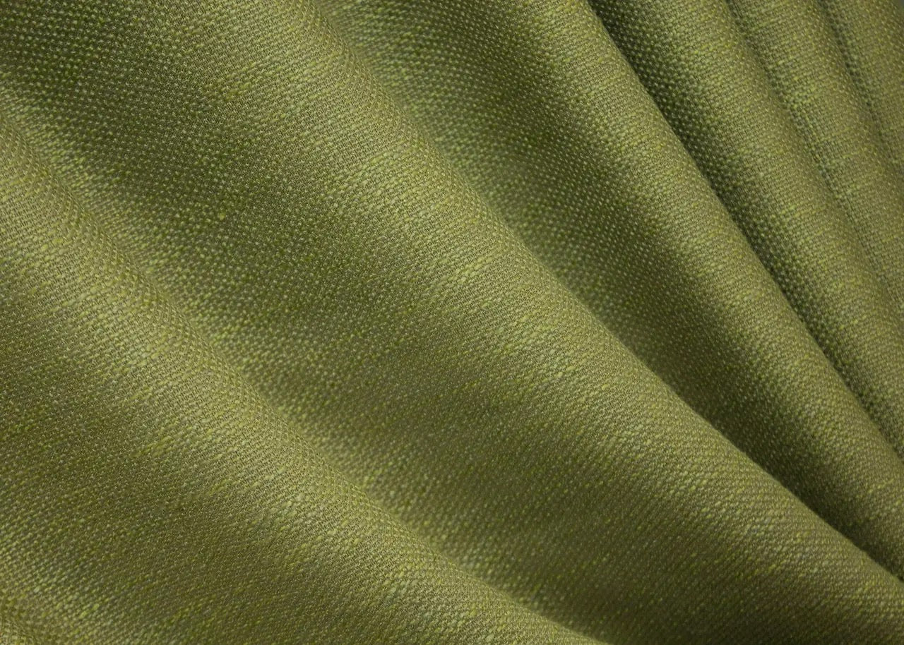 Nature-inspired light green linen drapes, creating a cosy and sophisticated ambiance in bedrooms and living rooms.