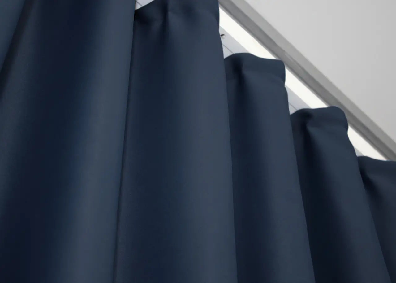 Ocean blue blackout curtains crafted from high-quality fabric for a refined look.