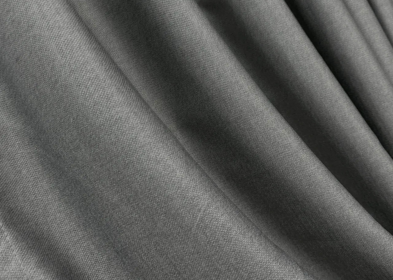 Pewter grey plush blackout curtains, combining elegance and practicality.
