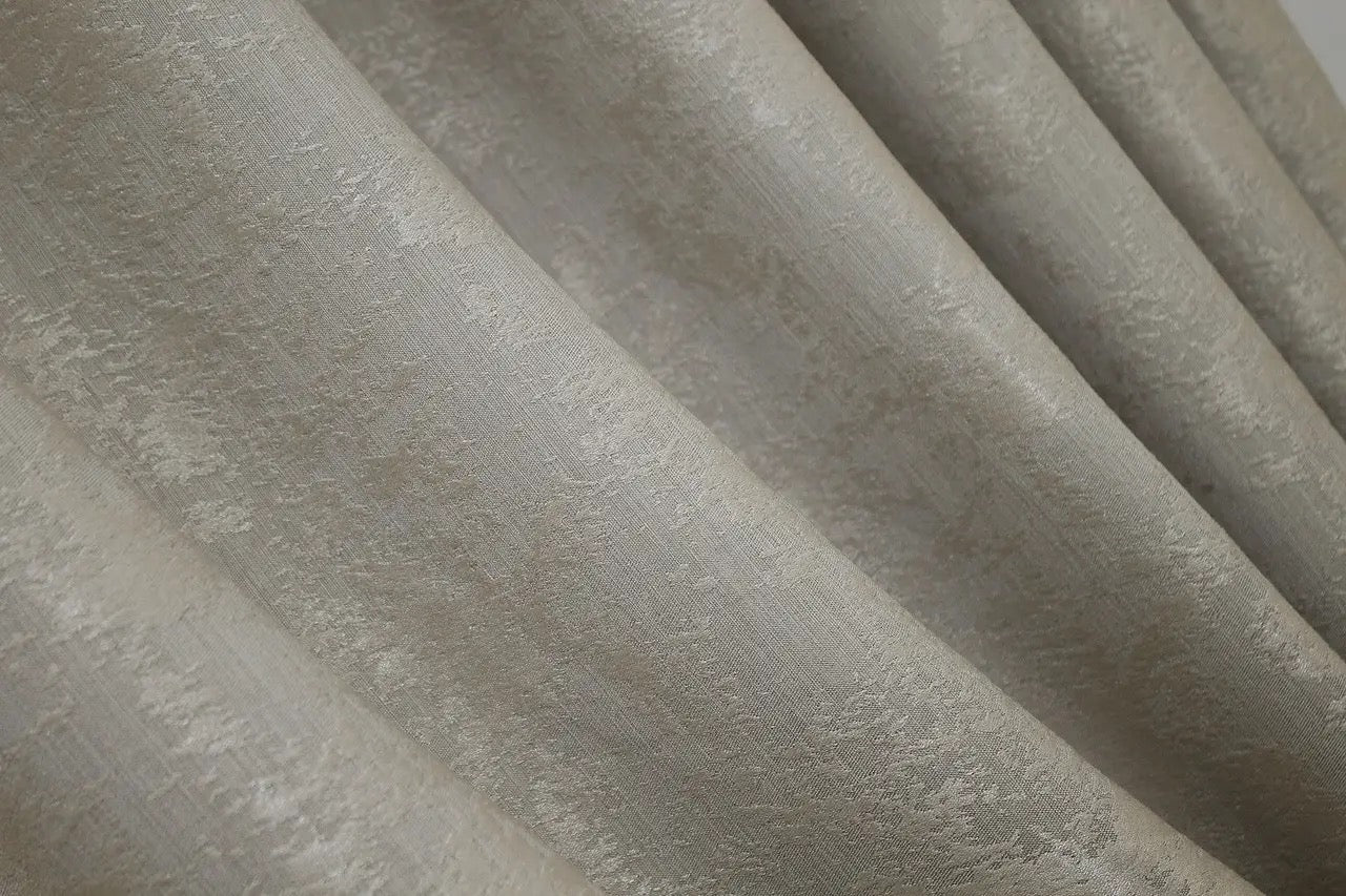 Warm-toned cappuccino curtains with an intricate woven jacquard pattern, adding depth and style to window décor.