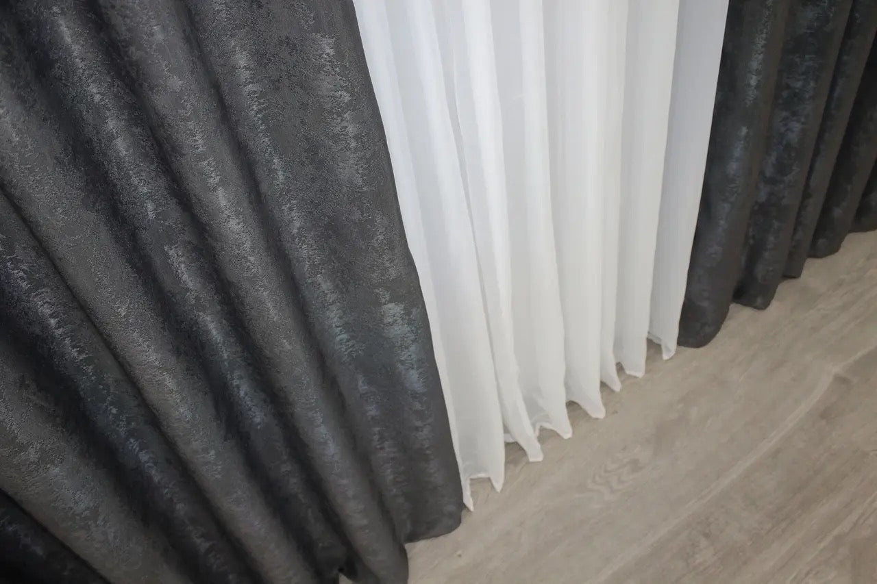 Luxurious graphite dark grey curtains with an intricate woven jacquard pattern, adding depth and style to window décor.