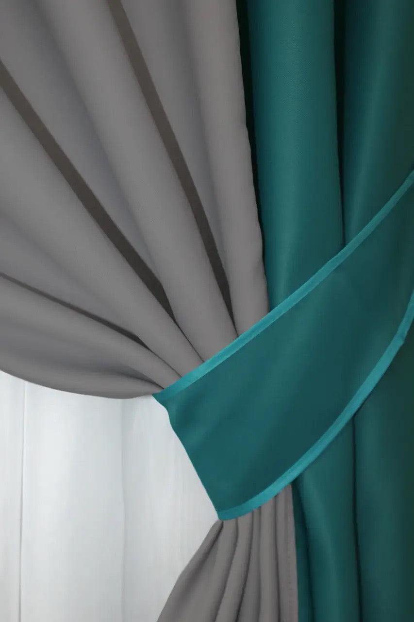 Elegant and stylish emerald and grey combined blackout curtains for a contemporary and cozy atmosphere.