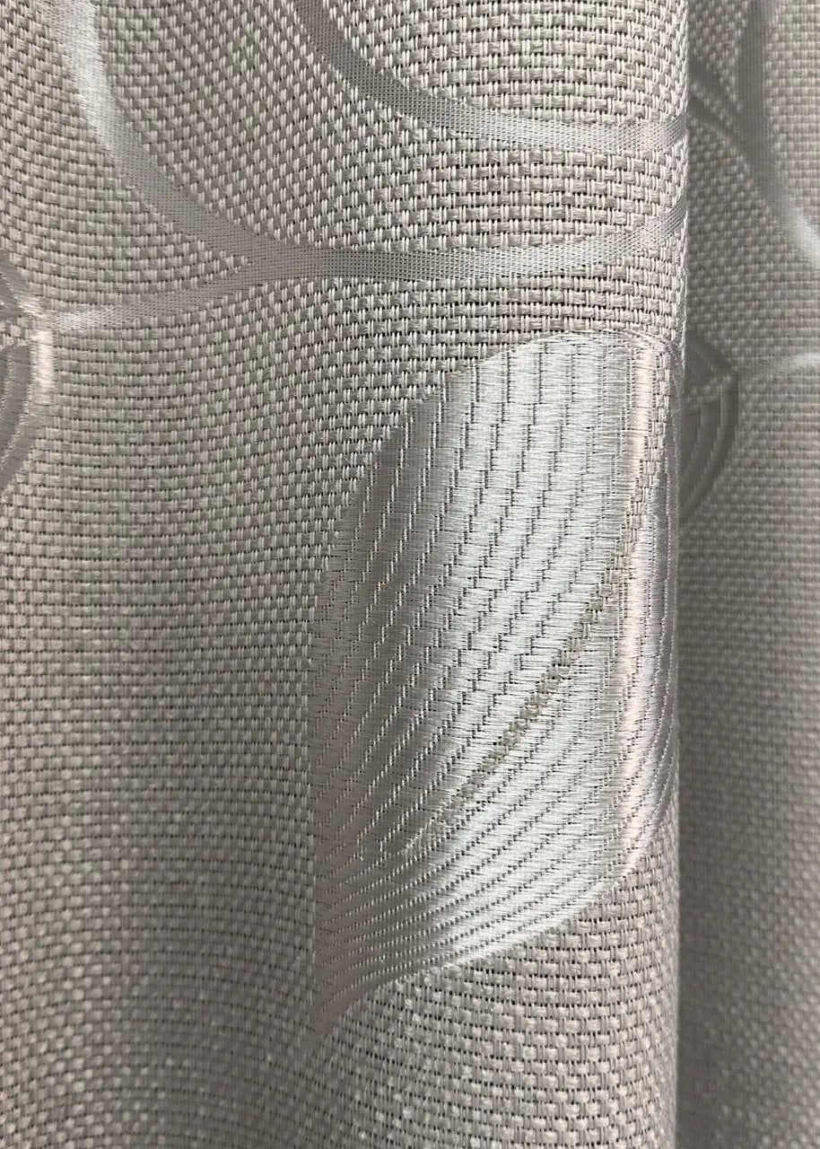 Sandstone-coloured linen-blend curtains with a flowing and natural drape.