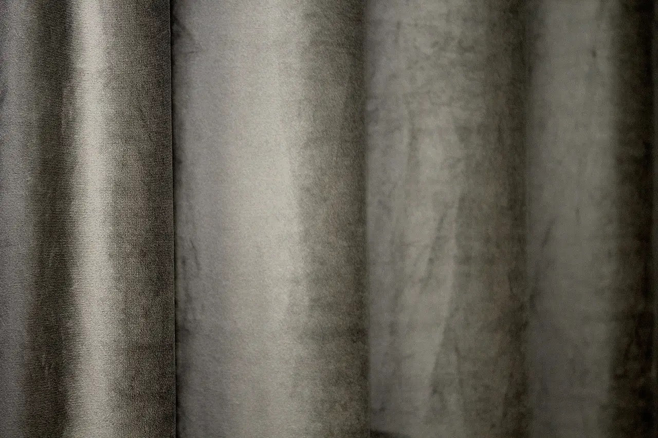 Moss green velvet blackout curtains for a cozy atmosphere in any space, designed to block light and offer privacy.