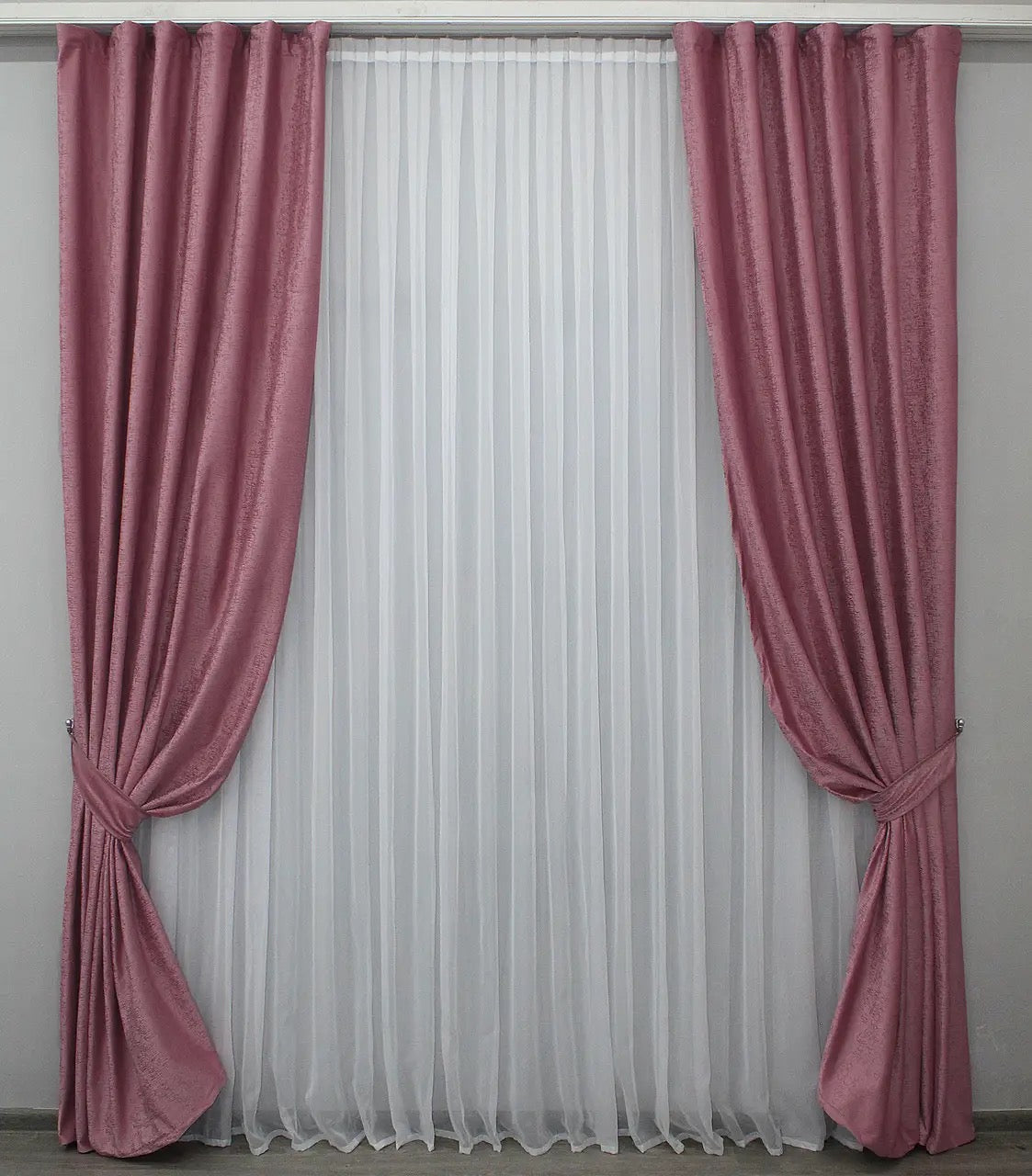 Elegant pink and gold velvet curtains with premium fabric and light-blocking features for creating a cozy and luxurious atmosphere.