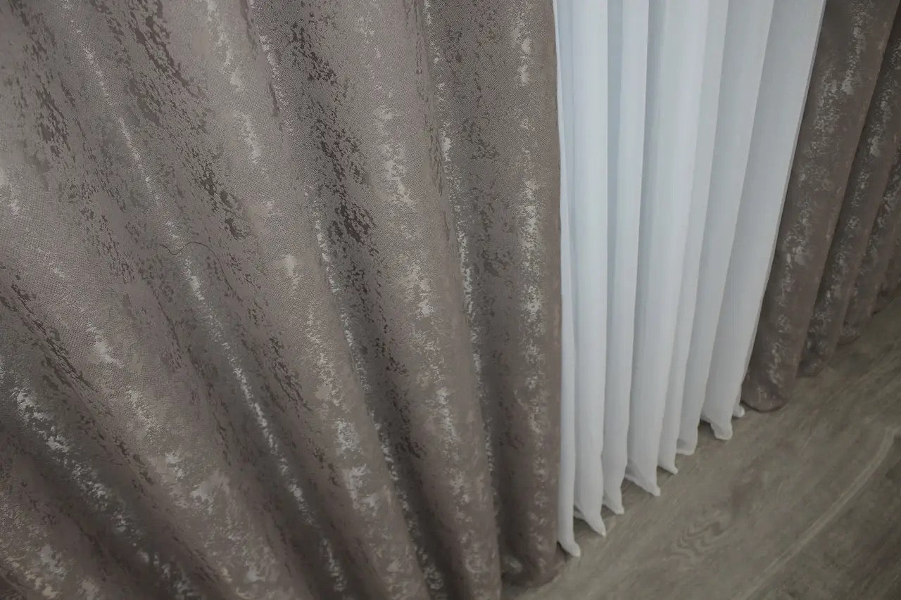 Classic brown-grey linen curtains with a smooth texture, enhancing natural light in modern and rustic interiors.