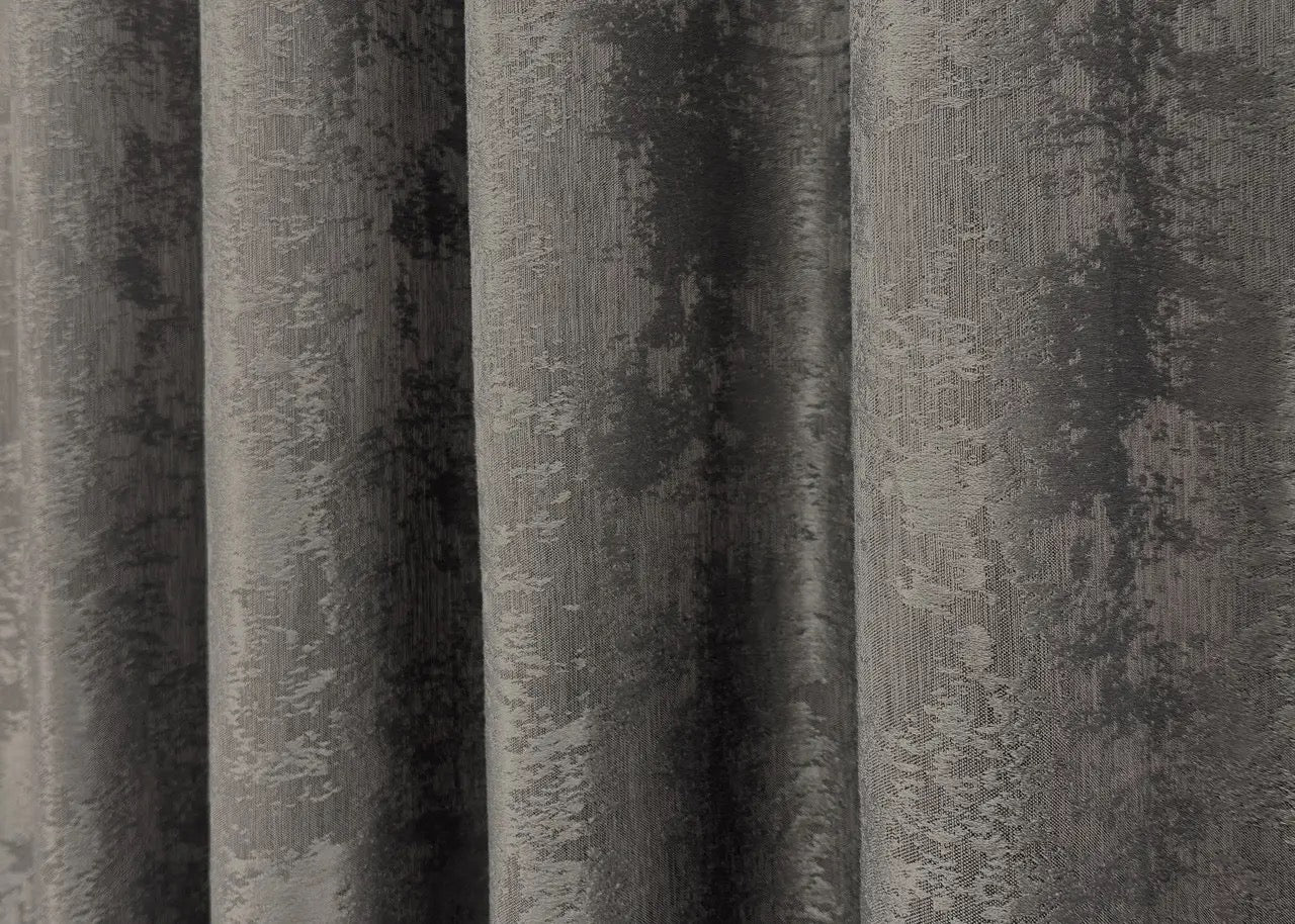 Opulent dark grey curtains with a textured jacquard design, bringing warmth and elegance to your home décor.