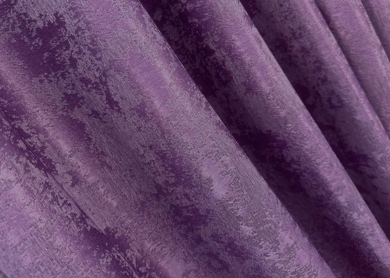 Opulent deep amethyst curtains with a textured jacquard design, bringing warmth and elegance to your home décor.