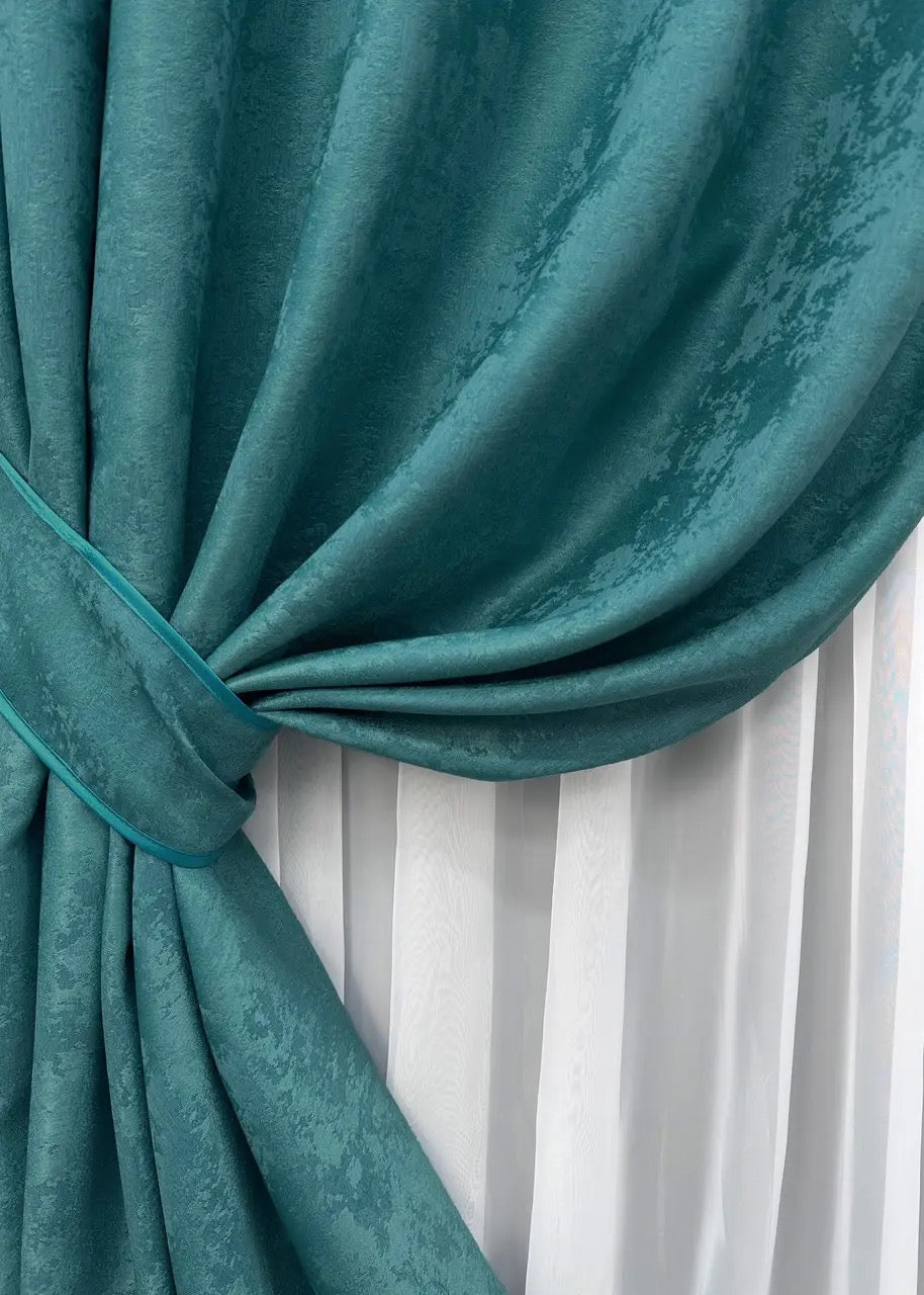 Opulent azure green curtains with a textured jacquard design, bringing warmth and elegance to your home décor.