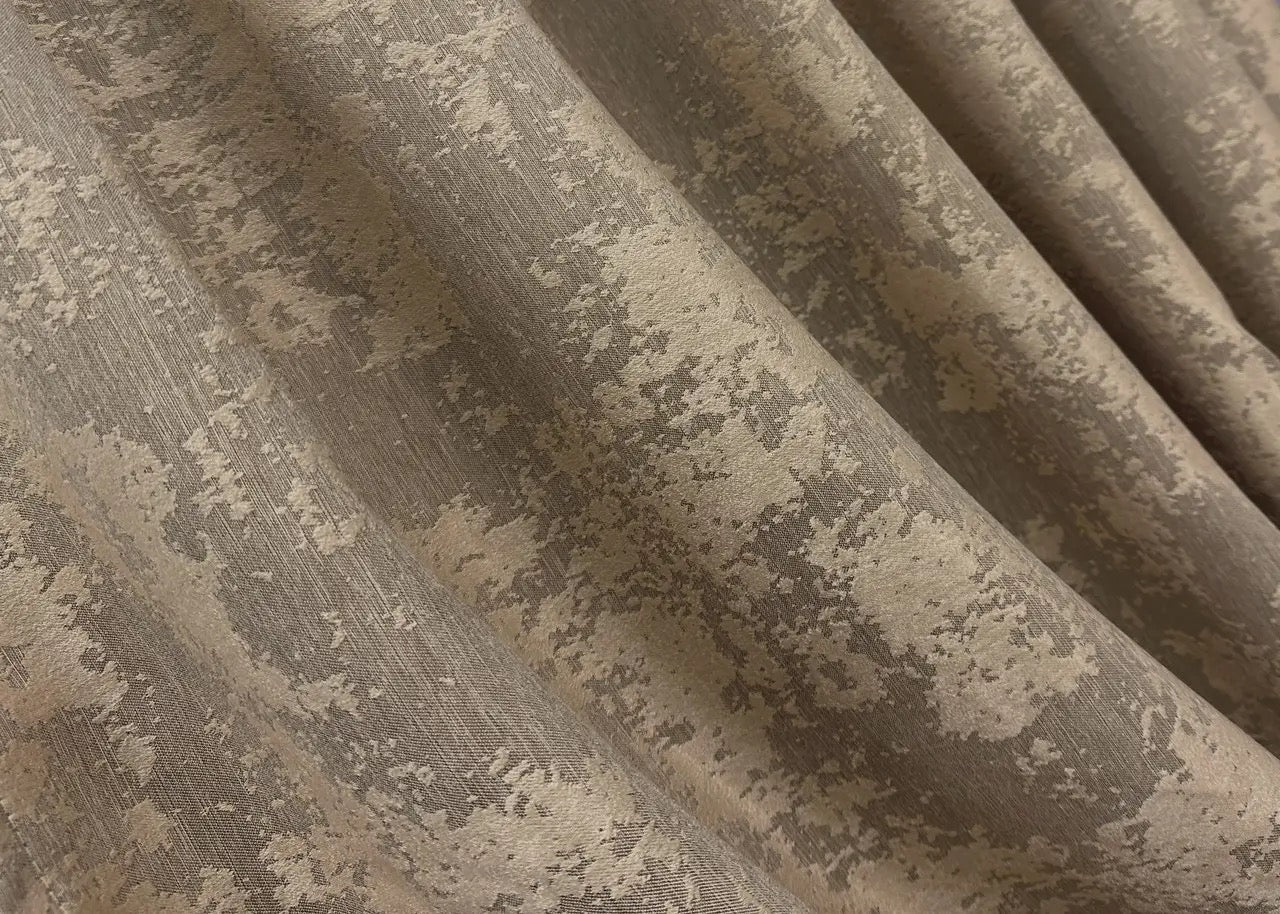 Opulent tan-golden jacquard curtains with a textured design, bringing elegance and charm to home décor.