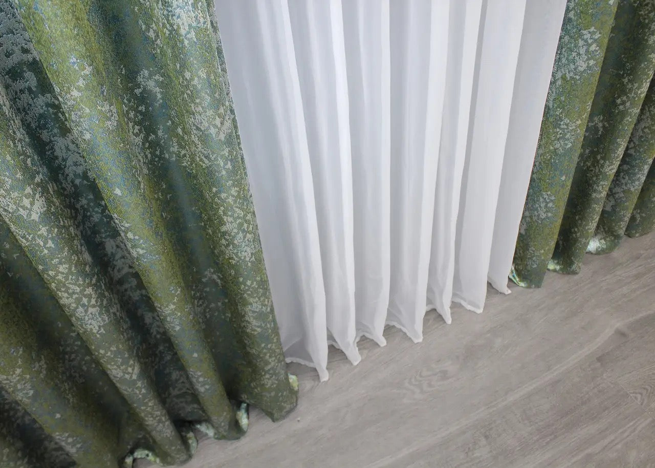 Timeless green linen curtains with a hint of turquoise, bringing sophistication and calm to any room.