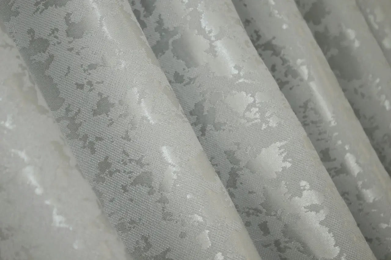 Luxury light grey linen curtains with a smooth and refined finish, ideal for creating a serene ambience.