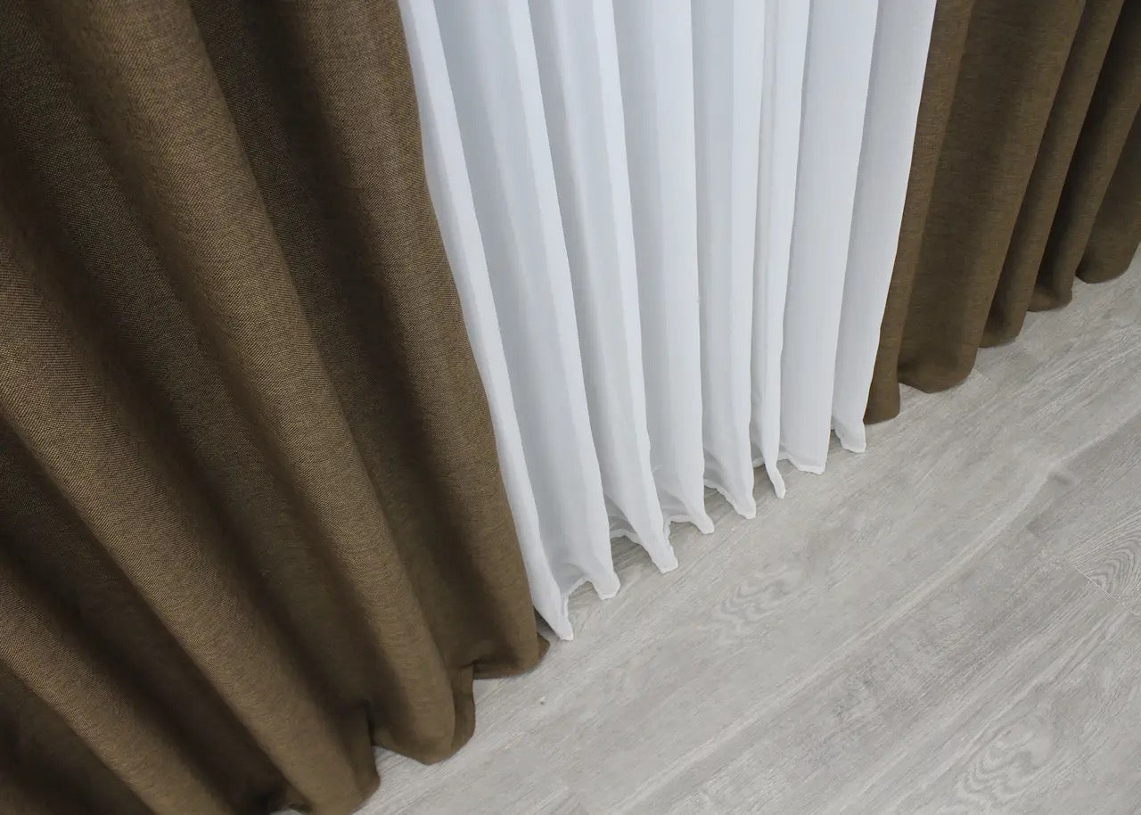 Scandinavian-style brown linen curtains with a rustic textured finish for modern and classic interiors.
