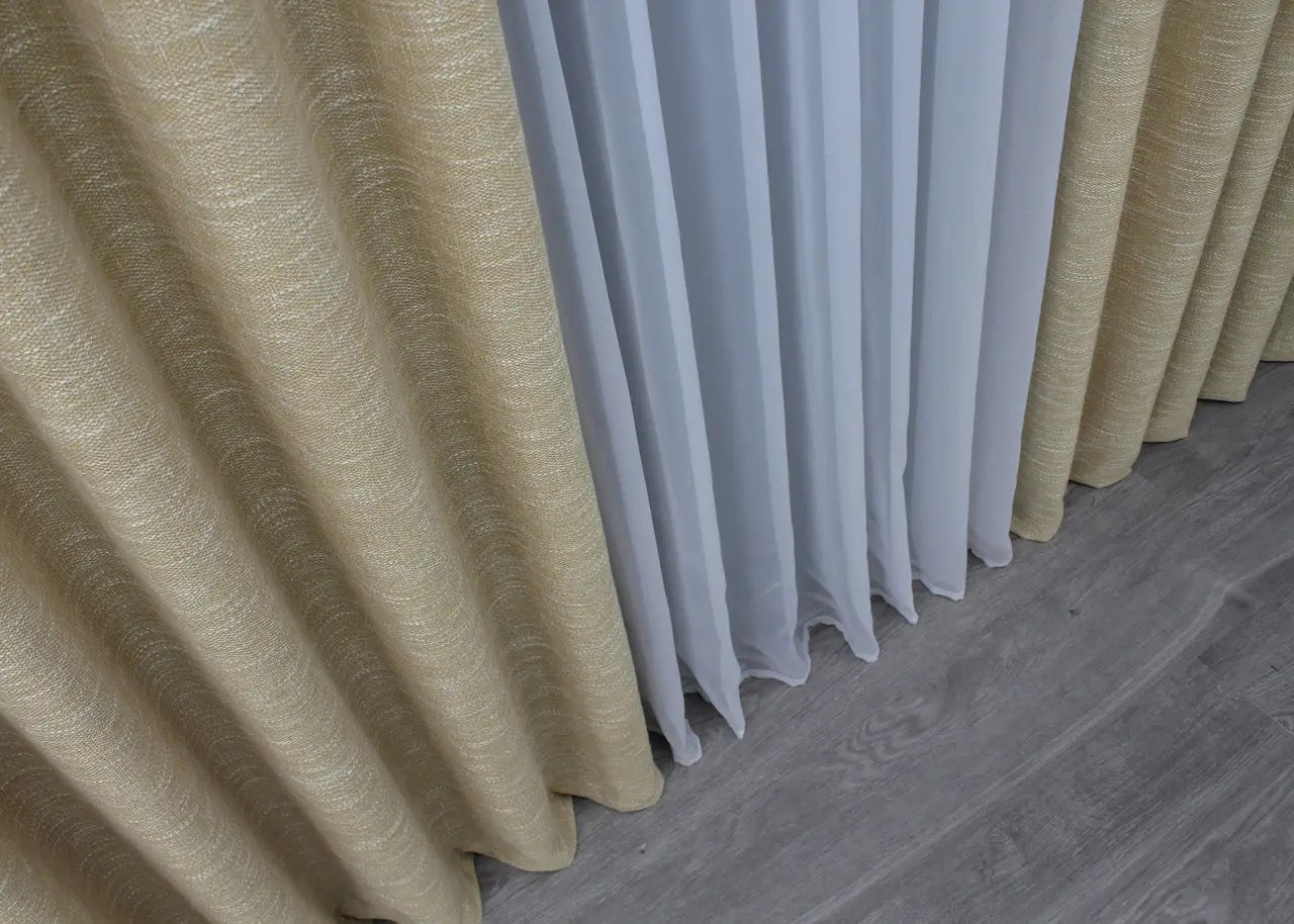 Scandinavian-style beige linen curtains with a textured coarse weave, perfect for a modern and rustic aesthetic.
