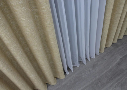 Scandinavian-style beige linen curtains with a textured coarse weave, perfect for a modern and rustic aesthetic.
