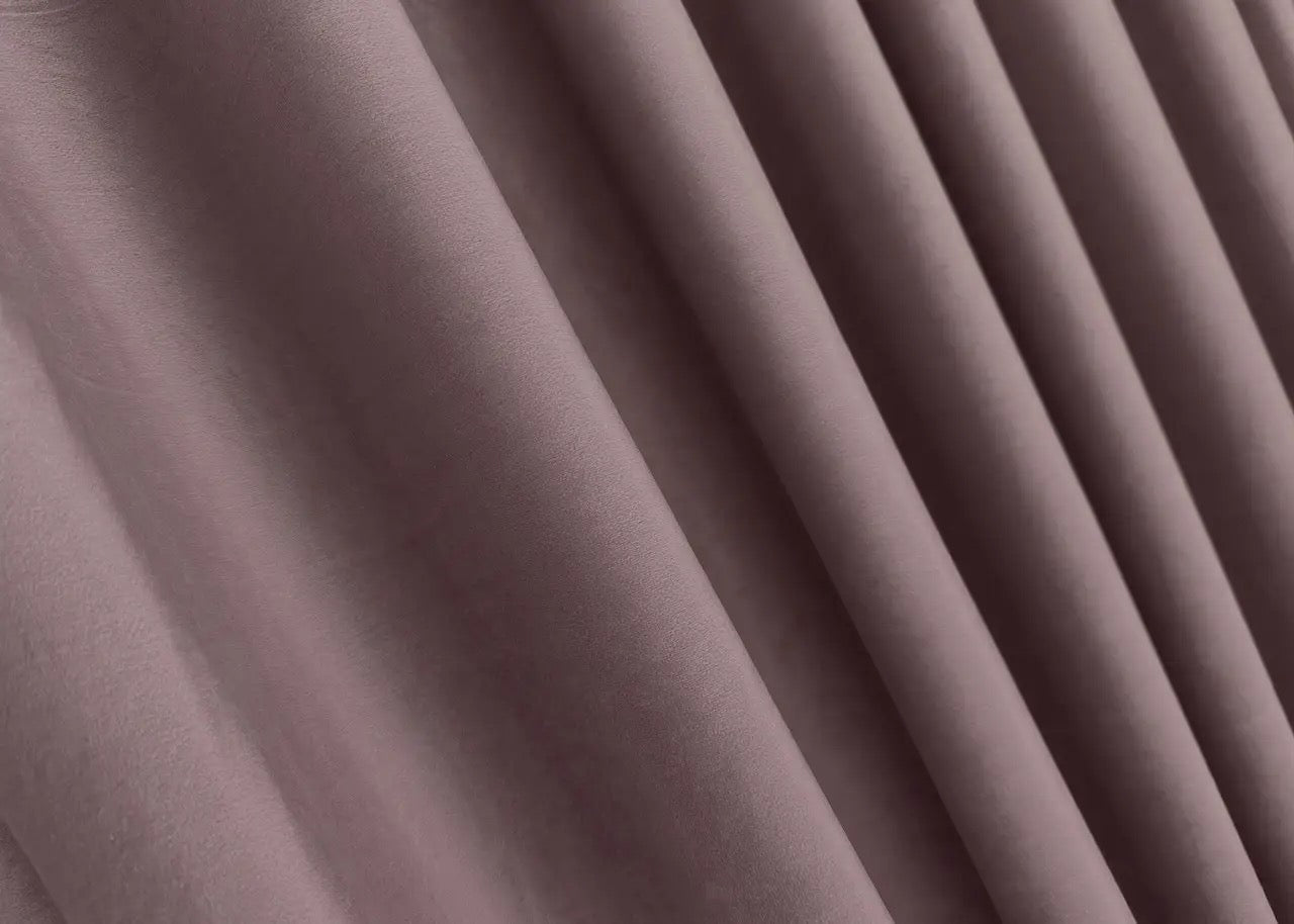 Antique rose luxury velvet curtains with premium blackout properties, perfect for contemporary home interiors and peaceful atmospheres.
