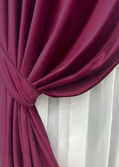 Aubergine velvet drapes, crafted for a refined and elegant look in bedrooms and living rooms.
