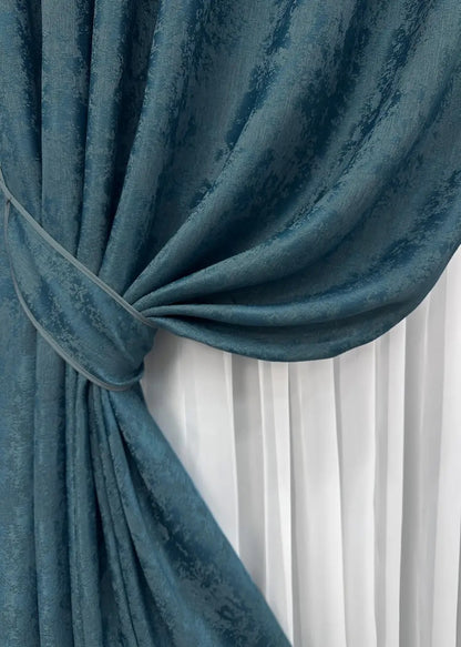 High-quality azure blue curtains made from premium jacquard fabric, complementing both contemporary and traditional home décor.
