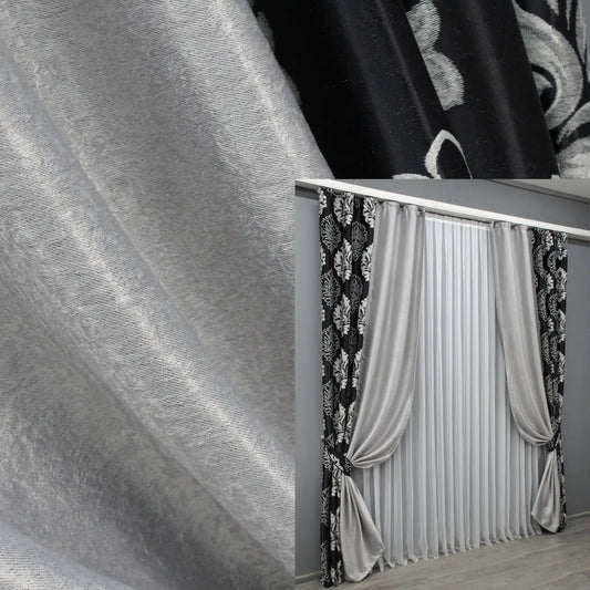 Black and light grey combined blackout curtains offering a modern two-tone design that enhances both elegance and functionality.
