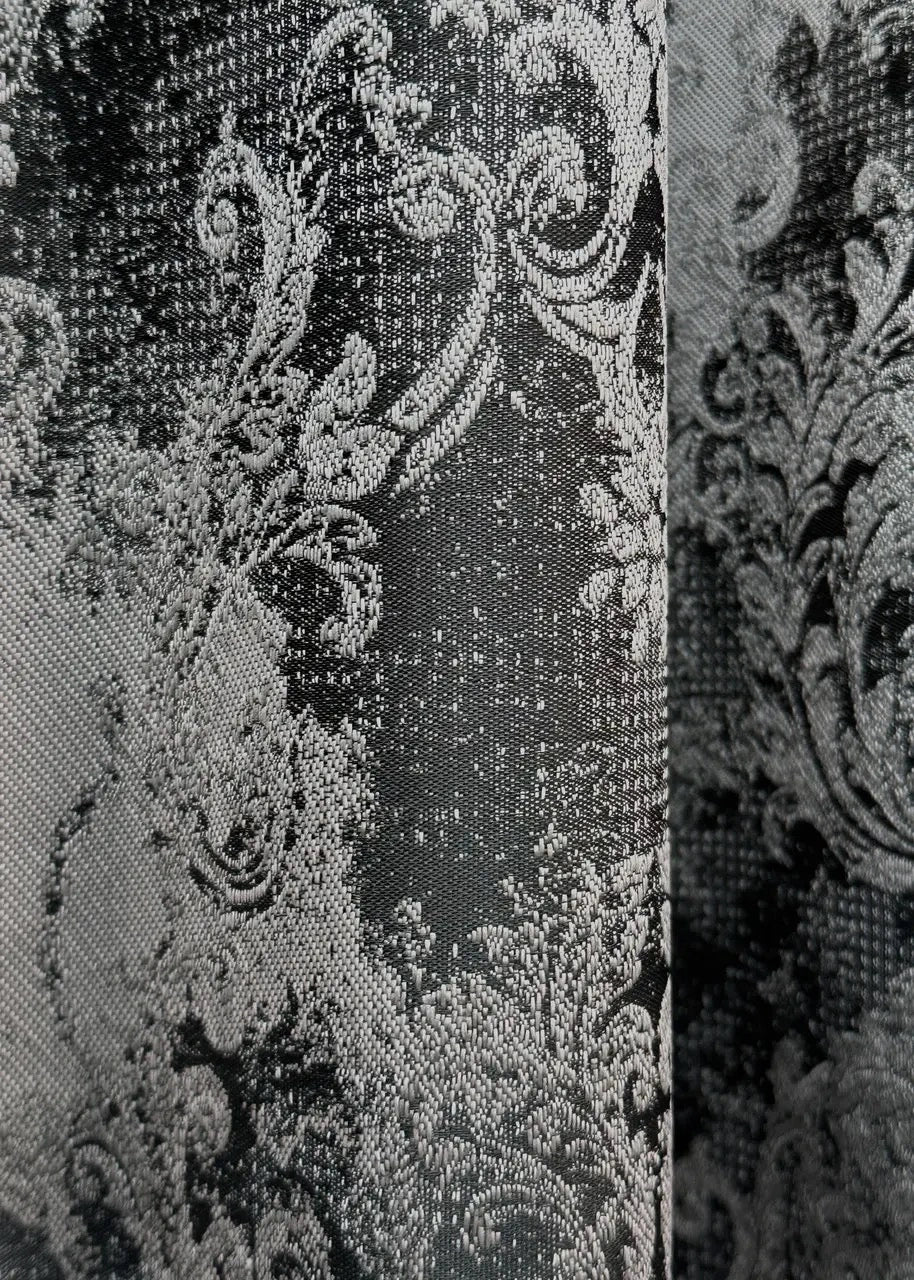 Black and grey premium linen curtains styled in a modern interior with elegant decor.